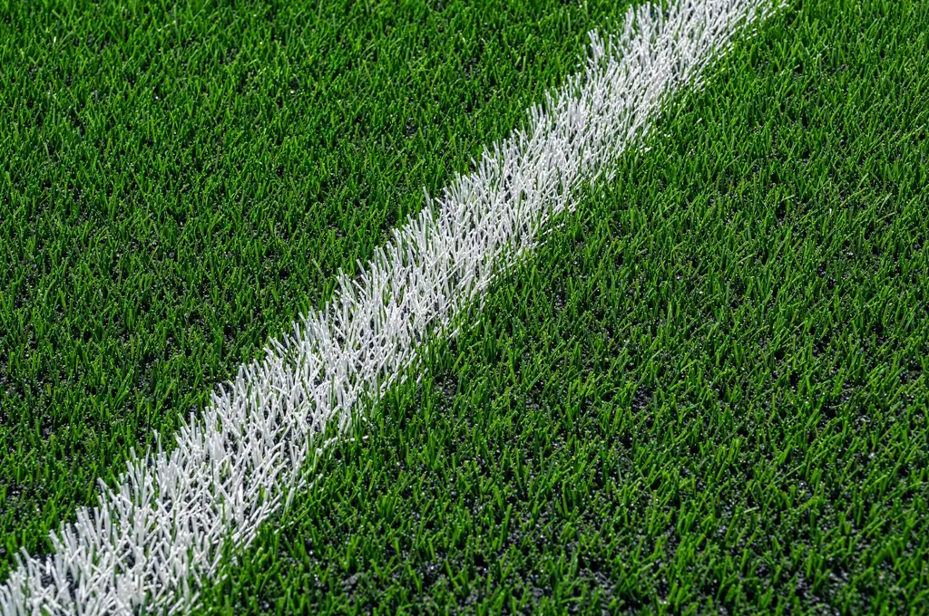 Close view of artificial grass with infill